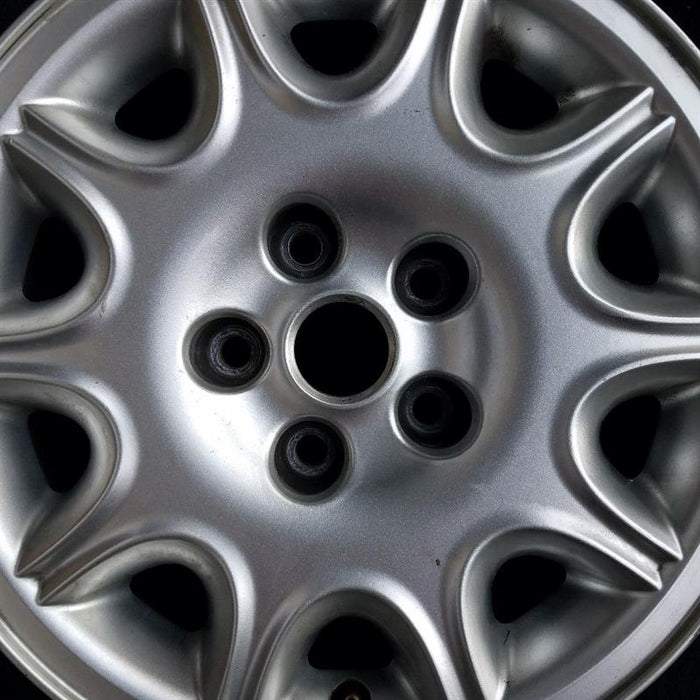 16" XJ8 98-99 16x7 alloy w/exposed lug nuts 10-triangle slots Original OEM Wheel Rim