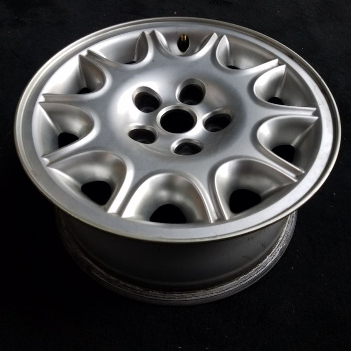 16" XJ8 98-99 16x7 alloy w/exposed lug nuts 10-triangle slots Original OEM Wheel Rim